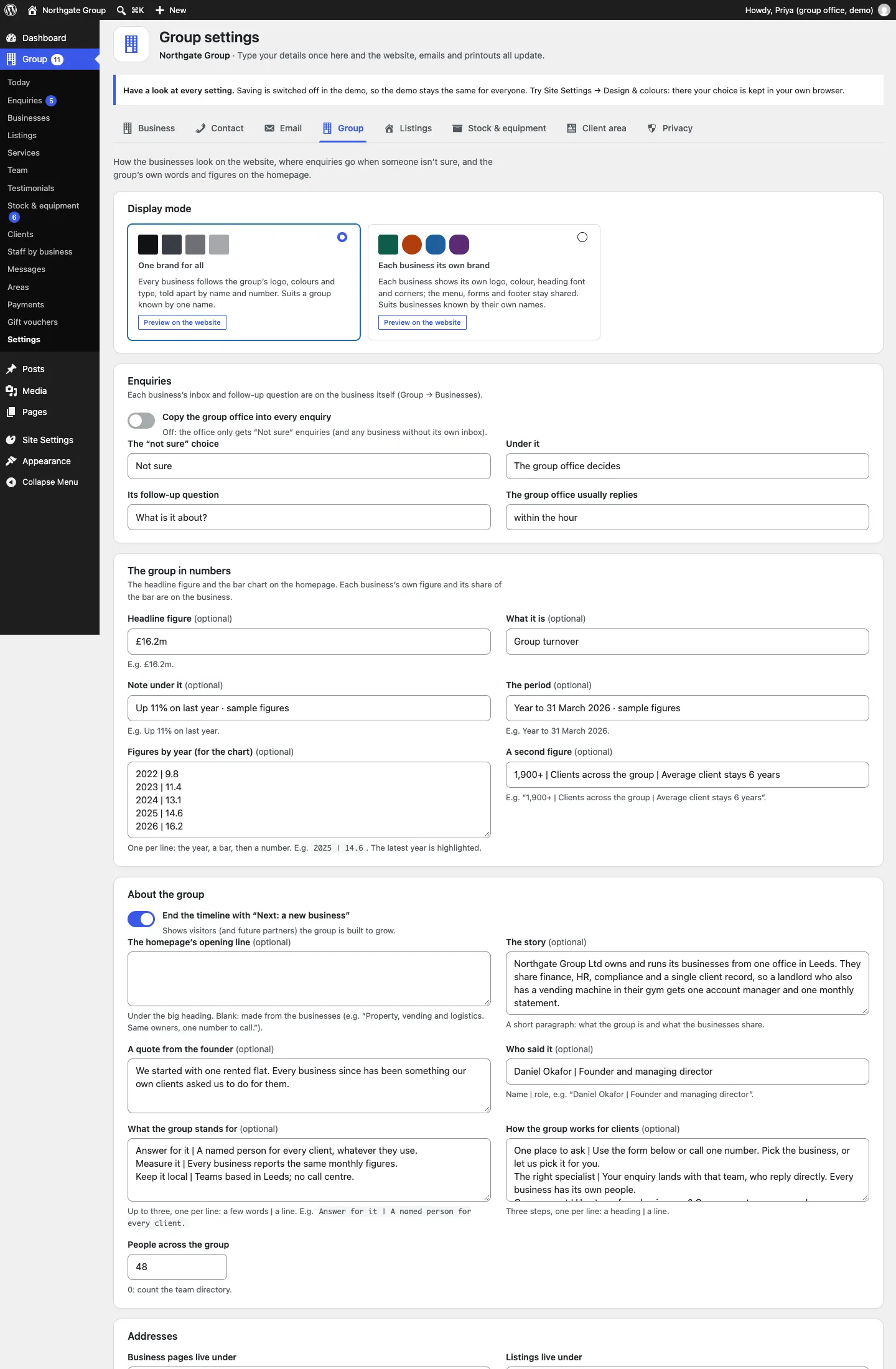 The Group tab of Group settings, showing the Display mode choices One brand for all and Each business its own brand, each with a Preview on the website link, then the Enquiries, The group in numbers and About the group sections